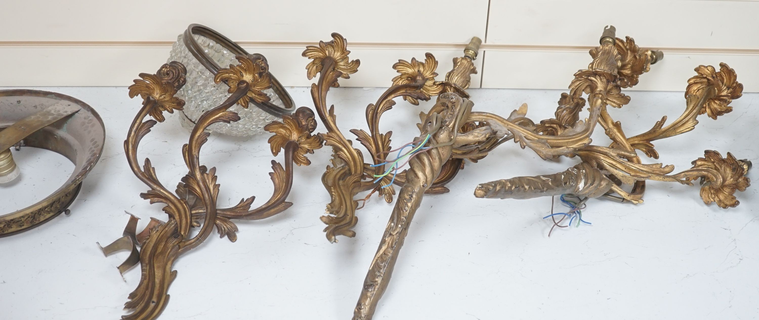 A pair of gilt metal 3 branch wall sconces, a pair of gilt plaster ditto and other light fittings